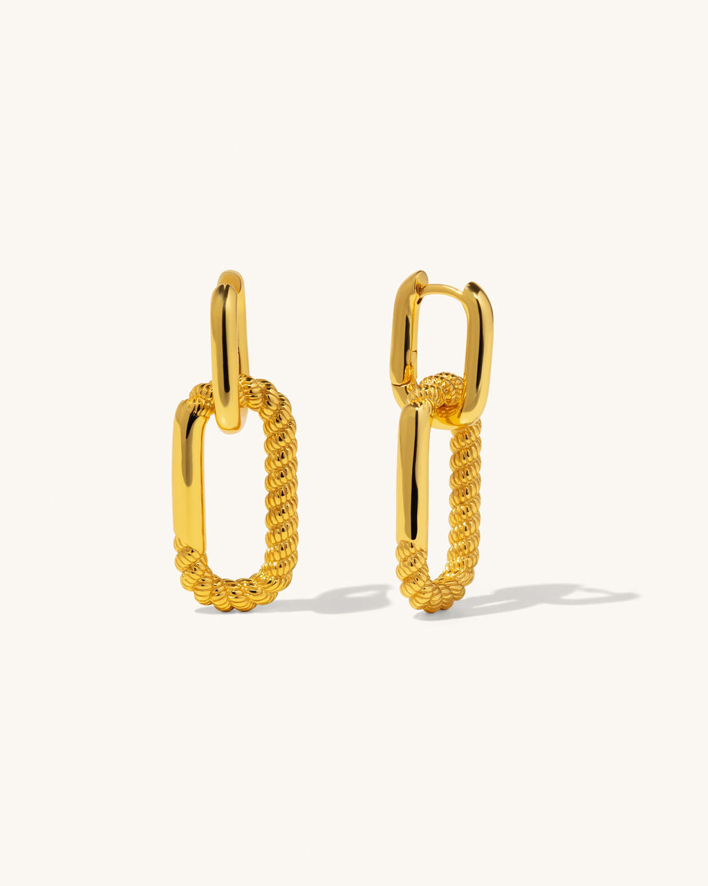 gold twisted chain huggie hoops with long hoop dangling in between jewelry earrings