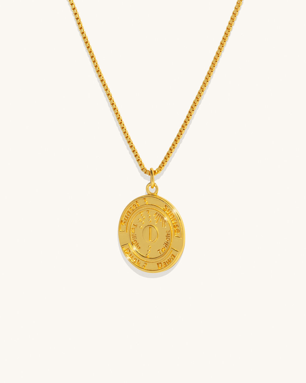 gold chain necklace with a coin pendant 