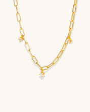 gold chain links that connect with 3 diamond pendants attached hanging off along the length of the chain jewelry womans fashion