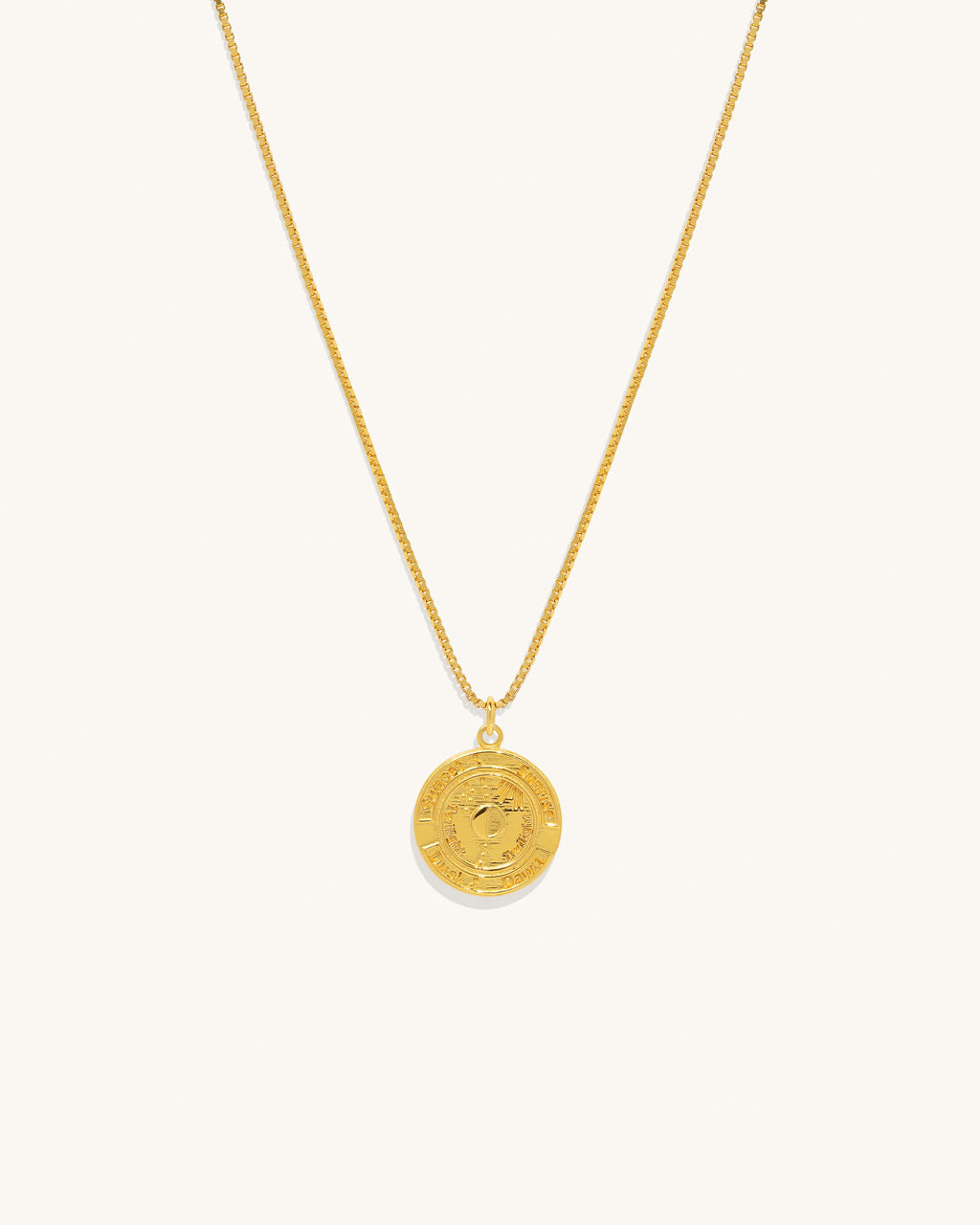 gold chain necklace with a coin pendant