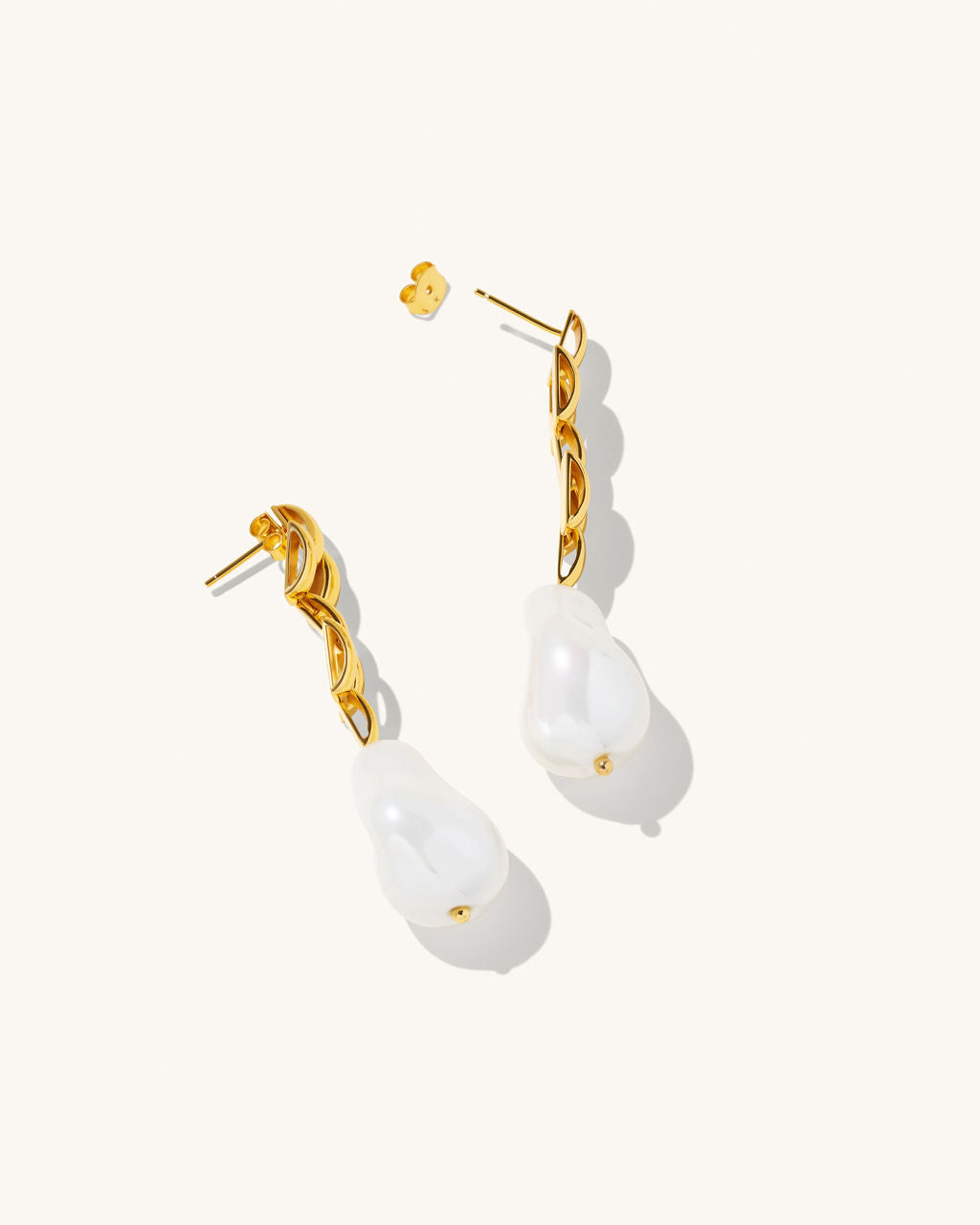 18k gold vermeil earrings fresh water pearl gold drop stud earrings twisted gold from stud and drops into a pearl