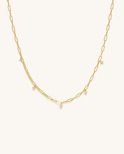 gold chain links that connect with 3 diamond pendants attached hanging off along the length of the chain jewelry womans fashion