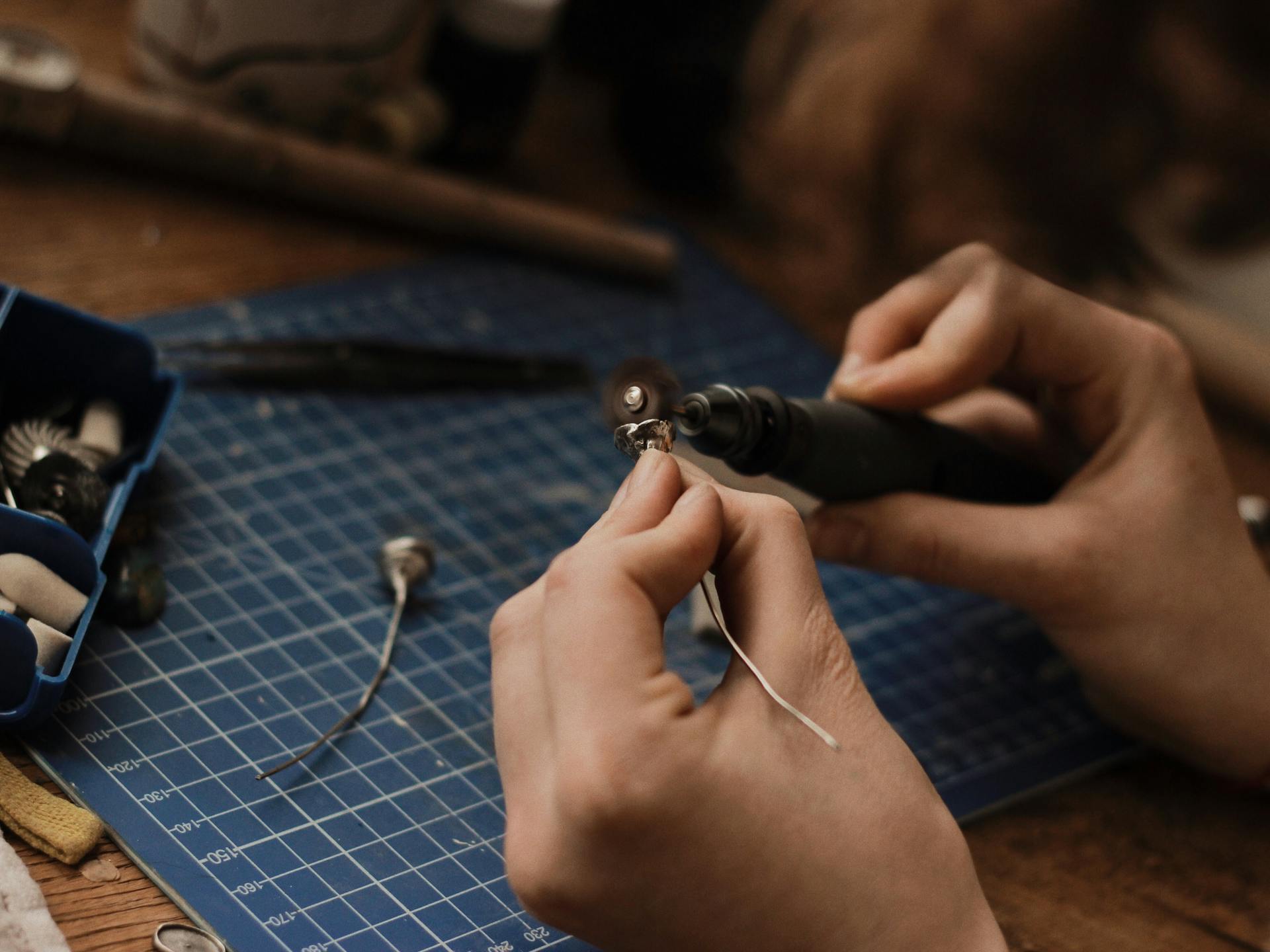 Artisan crafting gold vermeil jewelry by hand — the meticulous process behind every Aega piece